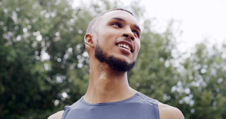 Fitness, thinking or man outdoor for rest, mental preparation or confident for running challenge. Positive mindset, ready or athlete contemplate jogging route, health or wellness goals for trainingの写真素材