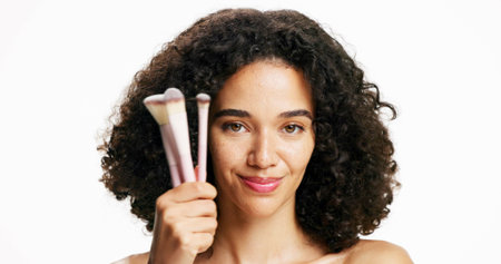 Makeup, brushes and portrait of woman in studio for beauty, cosmetics and self care routine. Smile,...