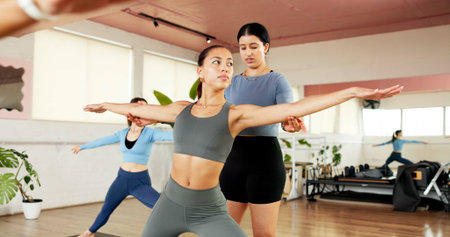 Yoga class, women and help with instructor for fitness, body health and stretching for wellness....