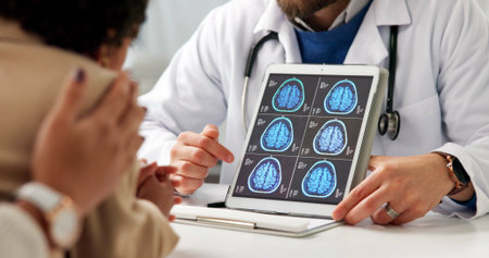 Doctor, tablet screen and brain scan with hands, talk and parent with child, mri and explain at...