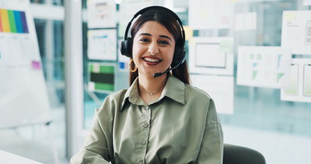 Happy woman, portrait and consultant with headset for web help or tech support in office. Female person, agent or smile with mic for virtual assistance, communication or online advice in workplaceの写真素材