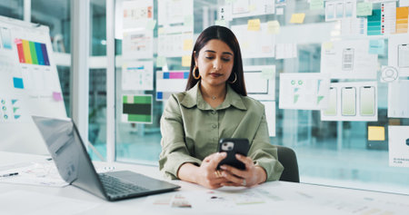 Business woman, web designer or phone with laptop for planning, strategy or UX in office. Female...