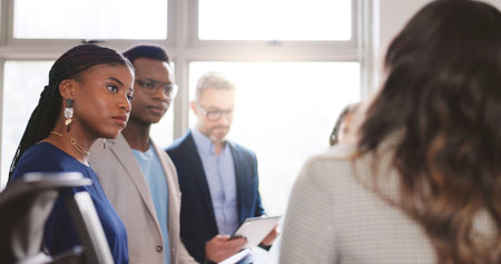 Attention, collaboration and meeting with business people in office together for feedback or review. Conversation, development and flare with employee group in corporate workplace for planningの写真素材