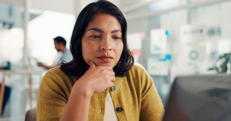 Office, proofreading and woman with laptop, thinking and planning for ebook on website and creative. Writer, review and person with tech for project, reflection and editing novel for publicationの写真素材