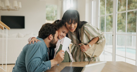 Excited, school report and parents with child in home for score, good grades and exam results. Bonding, family and happy mom, dad and girl hug with card for education, learning success and supportの写真素材