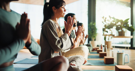 Zen, people and relax in yoga class with prayer hands for meditation, spiritual healing and...