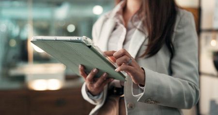 Hands, tablet and business woman in office for patent application, license agreement and lawyer at...