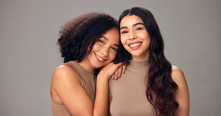 Portrait, women and friends in studio, haircare and nourishment of texture, growth and mockup space. White background, embrace and people with smile for hairstyle, cosmetics or pride for self careの写真素材