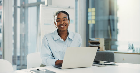 Business, laptop and happy black woman in company as insurance broker or opportunity. Computer, employee and portrait of confident person in office as claims consultant with pride in Kenyaの写真素材