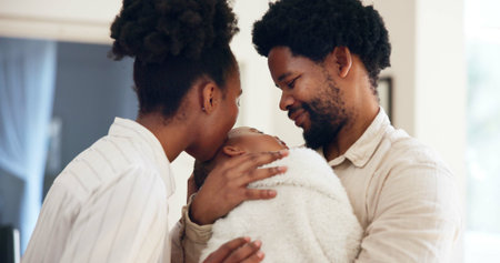 Happy family, parents or holding child with kiss in home for connection, support or bonding together. People, mother and father with daughter in apartment for affection, care or healthy relationship.の写真素材