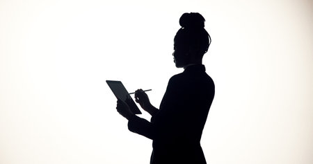 Stylus, tablet and business person in studio for brainstorming, online proposal and reflection. Space, mockup and silhouette on tech with ideas, solution and planning for project on white backgroundの写真素材