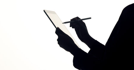 Hands, tablet and business person in studio for brainstorming, online proposal and reflection. Space, mockup and silhouette by tech with ideas, solution and planning for project on white backgroundの写真素材