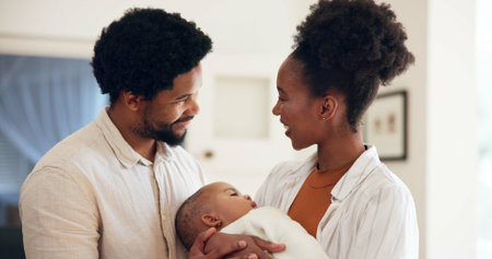 Happy family, parents and holding child in home with connection, support or bonding together....