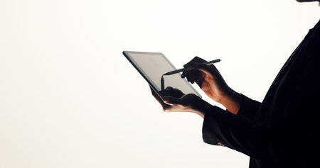Hands, tablet and business person in studio for brainstorming, online proposal and reflection. Stylus, mockup and woman on tech with ideas, solution or planning for project on white backgroundの写真素材
