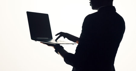 Hands, laptop and business person in studio for brainstorming, online proposal and reflection. Typing, mockup and woman on tech with ideas, solution or planning for project on white backgroundの写真素材