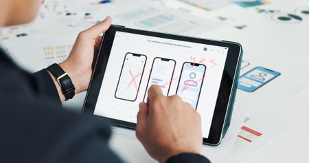 Person, hands and tablet screen with wireframes for UI design, software development or planning. Closeup, designer or technology display with digital blueprint for mobile UX, app testing or layoutの写真素材