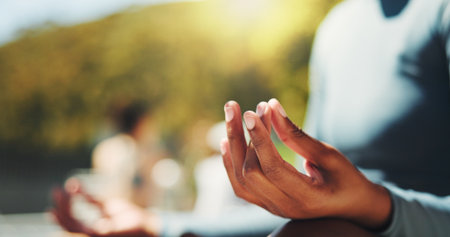 Lotus, hands and meditation for mindfulness, yoga class and spiritual for self awareness and outdoor. Zen, person and retreat for inner peace, chakra or stress relief with faith at wellness centerの写真素材