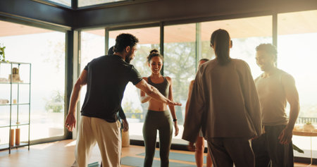 People, instructor and hand stack in yoga class with support, motivation and fitness success. Smile,...