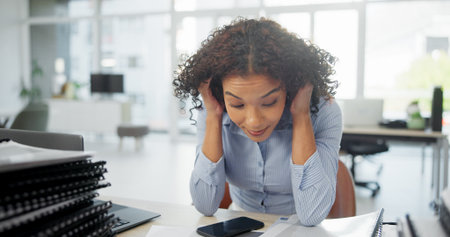 Frustrated, woman or tired in office with burnout from intense workload, finance crisis or pressure. Exhausted, overworked person or financial stress in workplace with fatigue, contemplation or issueの写真素材