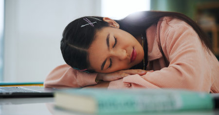 College student, girl or tired with sleeping in home for learning break, study fatigue or...