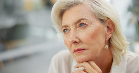 Business, woman or thinking in office with idea for problem solving, insight or investment decision. Space, mature person and reflection with solution, growth opportunity or plan for finance company.の写真素材