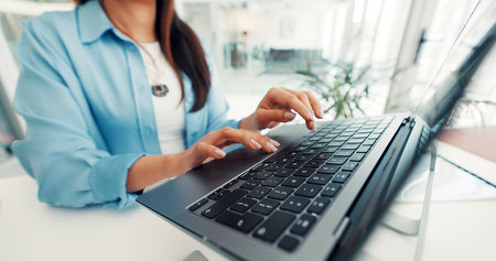 Hands, office and business woman on laptop for finance report, online research and proposal. Professional, corporate and worker typing on computer for financial review, website and budget planningの写真素材