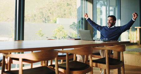 Excited, businessman and winning with laptop, good news or accomplishment for promotion in office. Happy man, fist pump or smile with celebration or computer for bonus salary or business successの写真素材