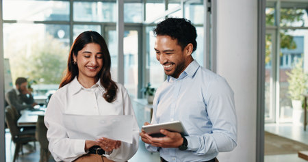 Review, graphs or people in office with paper, investment opportunity or collaboration in progress report. Happy, team or analyst in agency with tablet, discussion or revenue growth in budget update.の写真素材