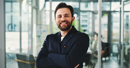 Happy, crossed arms and portrait of businessman in office with confidence for finance career. Smile, professional and male financial manager with pride for job development in workplace in Germany.の写真素材