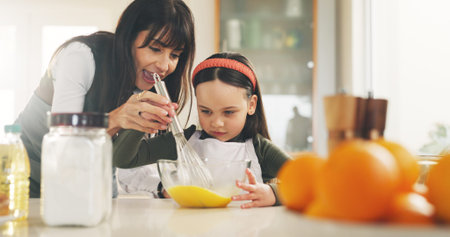 Baking, bowl and girl in kitchen with mother for child development. ingredients or recipe learning....