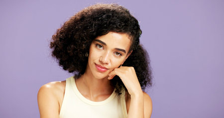 Portrait, skincare or woman with cosmetics in studio, natural beauty or facial shine for wellness. Glow, makeup aesthetic or gen z person with dermatology for self care, space or purple backgroundの写真素材