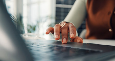 Woman, hands or research in office with laptop for sustainability report, esg policy info or plan. Person, scroll or browse with computer for environmental compliance audit, risk management or reviewの写真素材