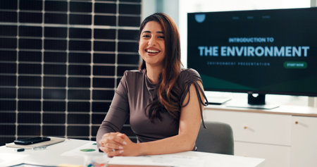 Portrait, business and woman with solar panel in office for career pride, about us and project. Smile, person or ambition of environment awareness, green energy presentation and photovoltaic solutionの写真素材