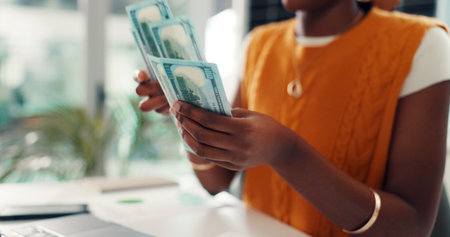 Business woman, hands and counting with money in office for cashflow, budget or expenses. Closeup, female person or accountant with dollar bills for financial planning, cost or savings in workplaceの写真素材