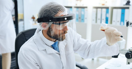 Sample, science and visor with man in laboratory for development, investigation or medical research....