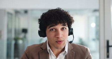 Video call, webinar and portrait of business man in office for virtual consultant, headset and broker seminar pov. Online meeting, digital conference and financial advisor with person for bokehの写真素材