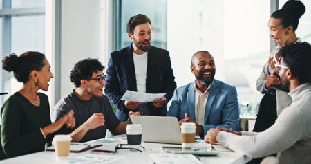 Business people, surprise and excited at office meeting, finance and achievement with revenue goals. Team, men and women with good news, profit and review charts with success at investment agencyの写真素材