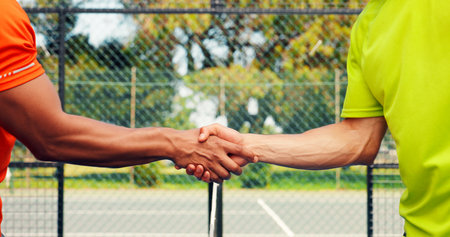 Men, handshake and padel with court for game start, match or beginning outdoor competition. Closeup, male people or athletic players shaking hands for sport tournament, challenge or training on turfの写真素材