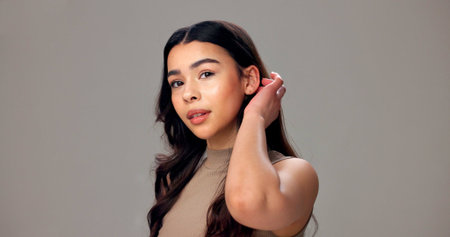 Haircare, cosmetics and woman in studio, portrait or maintenance of texture, shine and mockup space....