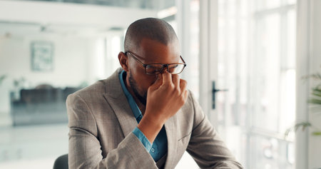 Black man, glasses or headache with stress, eye strain or mistake for wrong lens in office. Tired,...
