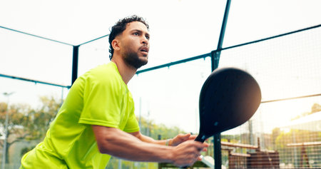 Padel, serve and training with man on court for sports athlete, contest and tournament club. Low...