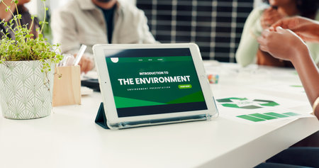 Sustainable business, tablet screen or hands of team in meeting, accountability or recycle plan. Green project, renewable energy or people with ideas for carbon footprint, tech or eco friendly officeの写真素材