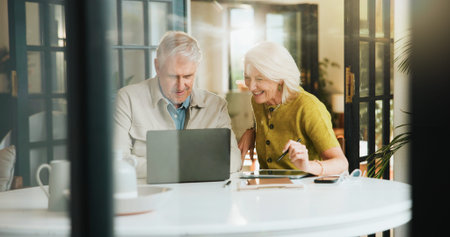 Senior, happy couple and planning retirement with laptop for online booking, vacation or getaway....