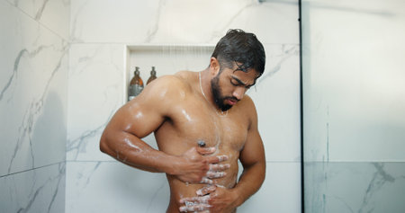 Water, body wash and man in shower in bathroom for germs, dirt or bacteria removal with hygiene....