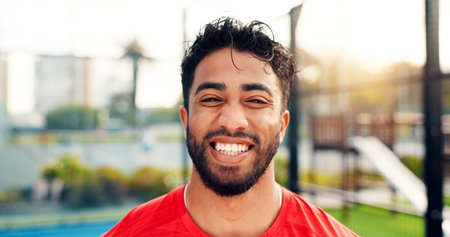 Happy, sports and portrait of man on court for game, tournament and competition outdoor. Tennis, athlete and person with smile for training, exercise and workout for challenge, practice and fitnessの写真素材