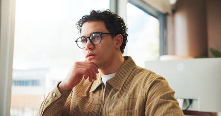 Office, thinking and journalist in digital agency for planning, article ideas or change story perspective. Reflection, new writing angle or man with creative process, draft insight or clear narrativeの写真素材