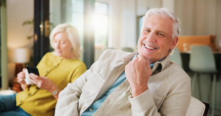 Portrait, smile and weekend with old man on sofa in living room of home with wife for retirement....