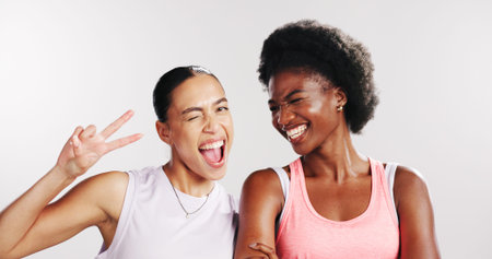 Peace sign, fitness and portrait of women in studio with confidence for exercise, training and...