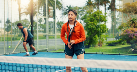 Woman, padel or waiting for serve on court with sports game, competition practice or fitness development. Agile, person or athlete outdoor with racket for tennis workout, tournament training or readyの写真素材