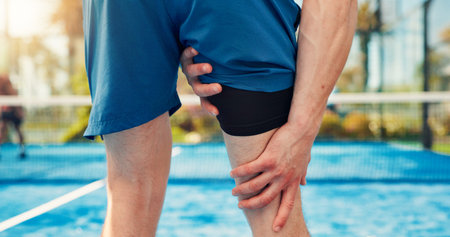 Hands, person and leg pain on tennis court from fitness, match accident and muscle sprain. Player,...